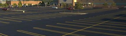 Sam's Club parking lot with new black pavement