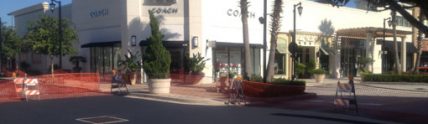 new pavement in front Coach store at shopping center