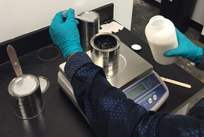 lab worker mixing chemicals in lab