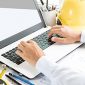 gentleman typing on laptop