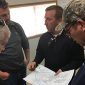 group of guys going over material specification
