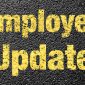 employee update in yellow paint on pavement