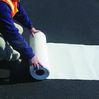 gentleman unrolling white thermoplastic tape